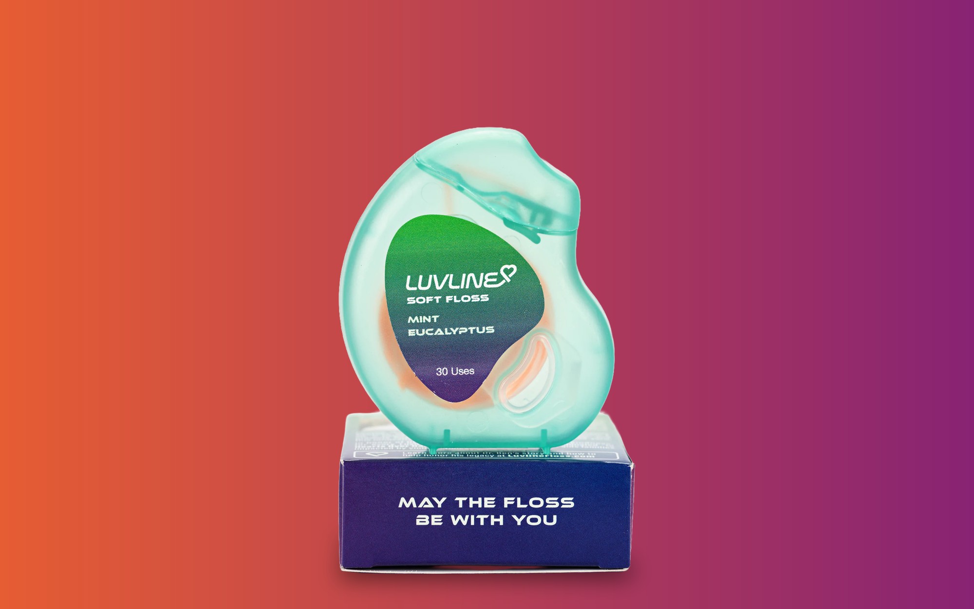 The LuvLine Mint Eucalyptus dispenser sitting on its carton, reading May the floss be with you