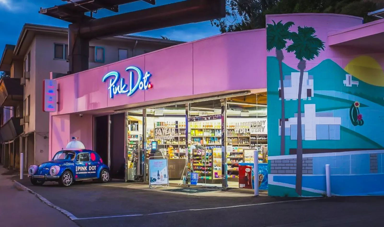 Pink Dot storefront with iconic VW Beetle delivery car