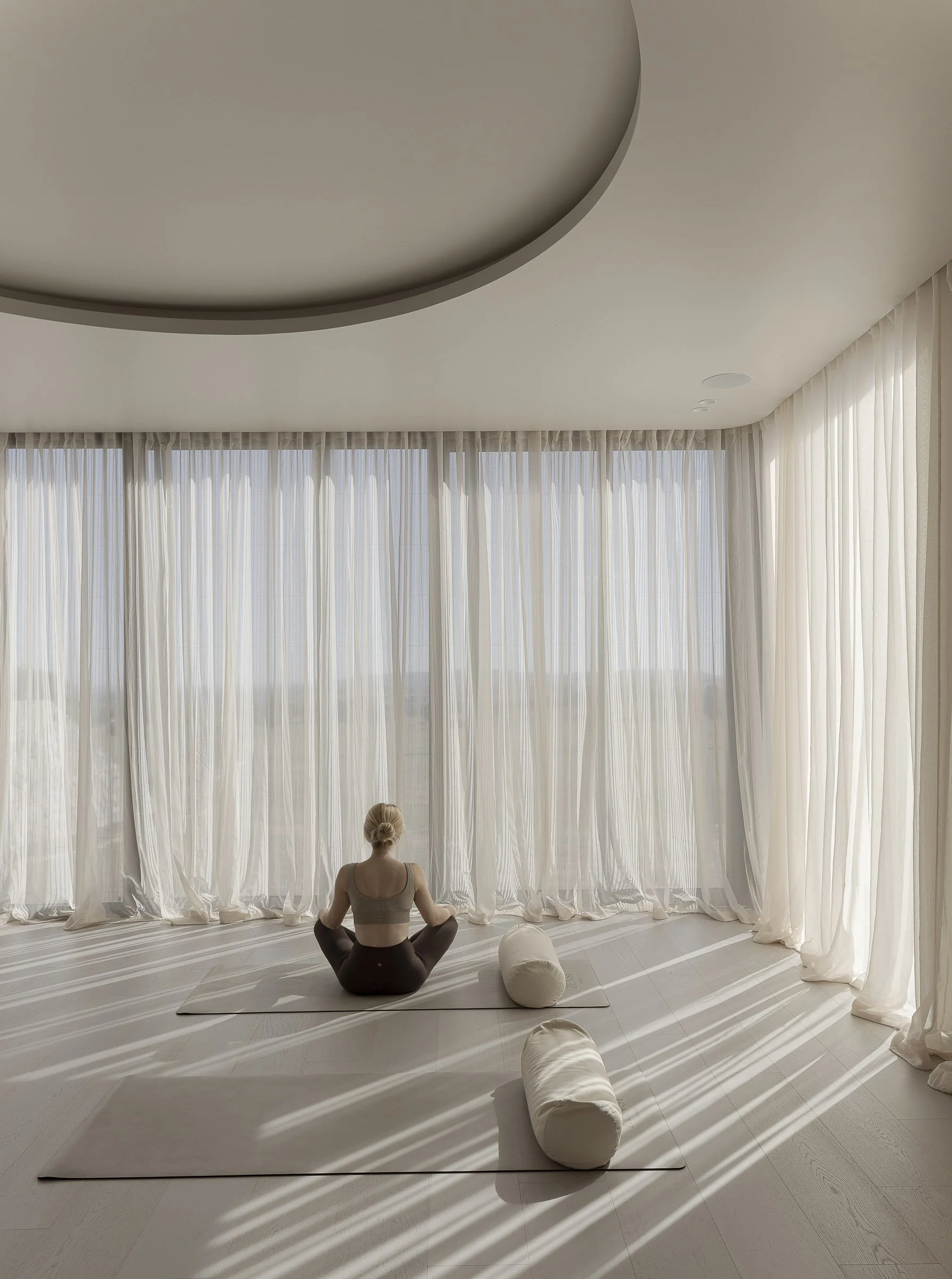 Zensi Retreat — wellness space with floor-to-ceiling sheer curtains